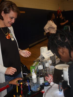 Science Education Supervisor Lisa Nance interacts with parents and students during Caddo School’s Title I STEM workshop hosted at Huntington High School on Oct. 22.