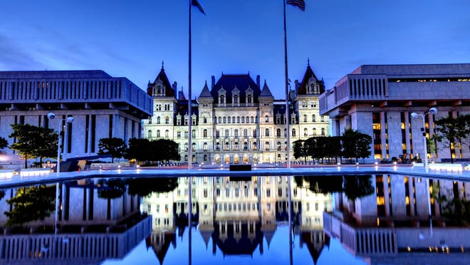New York State Capitol is the state capitol building of the U.S. state of New York located in Albany. The capitol is reflecting in a pool in Rockefeller Empire State Plaza. Albany is known for its culture, history, architecture, and institutions of higher education