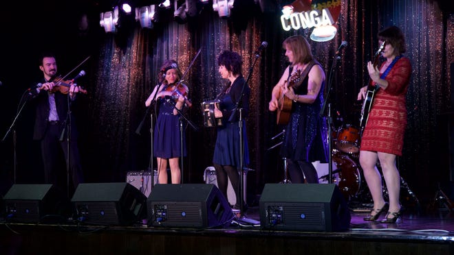 The Magnolia Sisters perform live with help from fiddle-playing, record producer Joel Savoy during the Only in Louisiana luncheon at the Conga Room on the eve of the Grammy Awards.