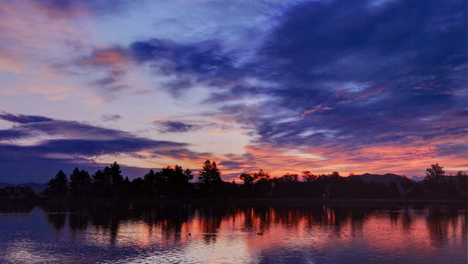 
Reader Dale Andrews sent this photo of a sunrise over Virginia Lake Aug. 18, 2014.

