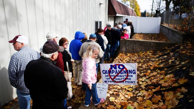In this November 2012 file photo, voters wait in a line that stretches into the parking lot at Stuarts Draft Rescue in Stuarts Draft. The county electoral board has asked to move the precinct to Ridgeview Christian School.