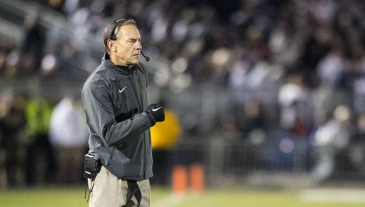 Head coach Mark Dantonio of the Michigan State Spartans walks onto the field between plays during the first half against the Penn State Nittany Lions on Nov. 26, 2016, at Beaver Stadium in University Park, Pennsylvania.