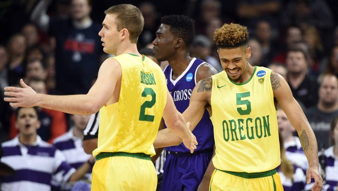 March 18, 2016; Spokane , WA, USA; Oregon Ducks guard Casey Benson (2) and guard Tyler Dorsey (5) celebrates a scoring play against Holy Cross Crusaders in the first round of the 2016 NCAA Tournament during the first half at Spokane Veterans Memorial Arena. Mandatory Credit: Kyle Terada-USA TODAY Sports