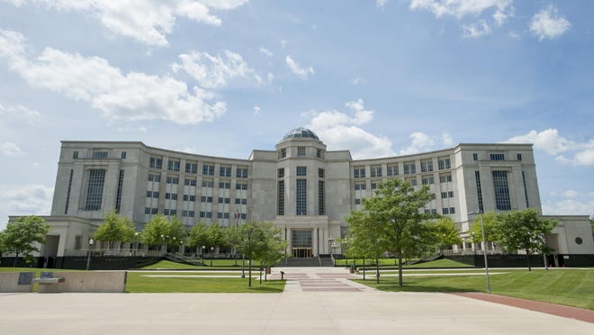 The Michigan Supreme Court is accepting comment on a proposal to allow the public to carry phones and other devices into courthouses.