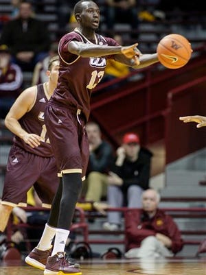 ULM forward Majok Deng (13), of Australia, passes during the second half of an NCAA college basketball game against Minnesota on Sunday in Minneapolis.