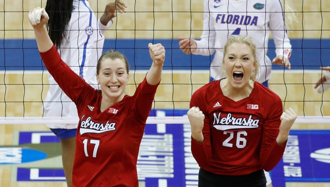 Nebraska outside hitter Annika Albrecht (17) and middle blocker Lauren Stivrins (26) celebrate a point against Florida during an NCAA Division I volleyball championship game Saturday, Dec. 16, 2017, in Kansas City, Mo. Florida middle blocker Rhamat Alhassan, back left, and Florida outside hitter Carli Snyder, right, react.