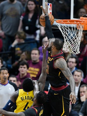 Cleveland Cavaliers forward LeBron James (23) blocks a shot by Indiana Pacers guard Victor Oladipo (4) in the fourth quarter in game five of the first round of the 2018 NBA Playoffs at Quicken Loans Arena.