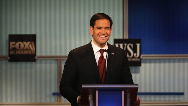 496588556.jpg MILWAUKEE, WI - NOVEMBER 10:  Presidential candidate Republican Sen. Marco Rubio (R-FL) smiles while giving closing remarks at the Republican Presidential Debate sponsored by Fox Business and the Wall Street Journal at the Milwaukee Theatre November 10, 2015 in Milwaukee, Wisconsin. The fourth Republican debate is held in two parts, one main debate for the top eight candidates, and another for four other candidates lower in the current polls.  (Photo by Scott Olson/Getty Images)