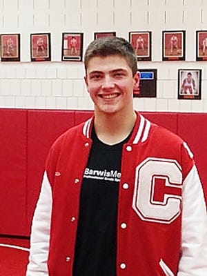 Canton’s Adam Armesto will play football at Columbia University. But he also loves being part of the prep wrestling scene.