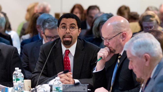 State Education Commissioner John King Jr., left, speaks during a Board of Regents meeting this year in Albany. The board panel recommended extending the phase-in of Regents exams that are based on the more difficult standards, known as the Common Core, so that the class of 2022, not the class of 2017, would be the first group required to pass more rigorous English and math exams to graduate.