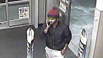 A surveillance photo shows a suspect wanted in connection with several credit fraud instances at area pharmacies.