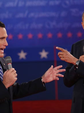 Mitt Romney and President Obama talk over each other as they answer questions during a town hall-style debate at Hofstra University on Oct. 16, 2012 in Hempstead, N.Y.