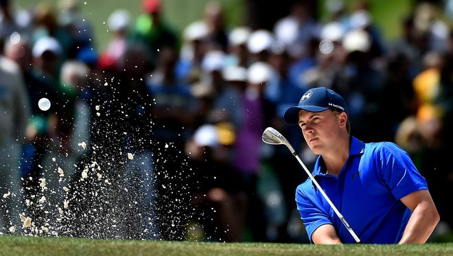 Jordan Spieth hits from a bunker along the seventh green during the second round of the 80th Masters at the Augusta National Golf Club on Friday.