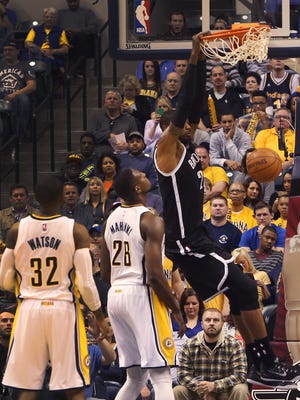Brooklyn Nets' Cory Jefferson dunks against Indiana Pacers' C.J. Watson (left) and Ian Mahinmi at Bankers Life Fieldhouse in Indianapolis on Saturday, March 21, 2015.