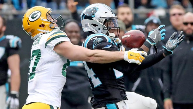 Green Bay Packers wide receiver Jordy Nelson (87) can't prevent Carolina Panthers cornerback James Bradberry (24) from intercepting an Aaron Rodgers pass on Sunday, December 17, 2017 at Bank of America Stadium in Charlotte, N.C.