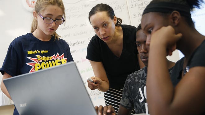 Crystal Nunes, second from left, works with students at Rebel Academy in Las Vegas last year. Rebel Academy, spearheaded by UNLV’s College of Education, is a project to give prospective teachers hands-on experience during the summer.