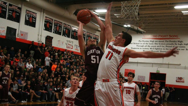 Dayton’s Ty Pearson tries to get a shot off over Fernley’s Kevin Montgomery during their game in Fernley last Friday night.
