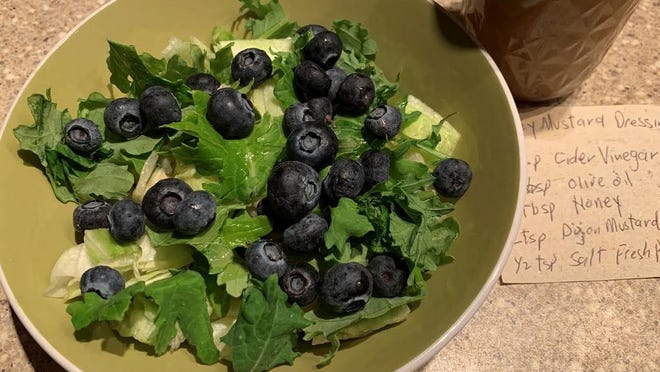 Honey mustard is good on a lot of things. Here, it's paired with a simple salad with blueberries.
