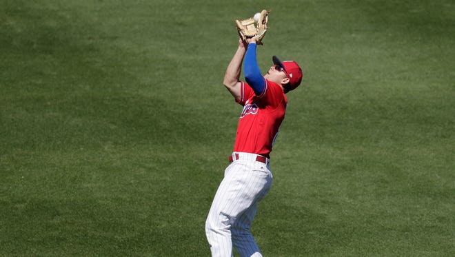 Phillies second baseman Scott Kingery catches a pop fly in a spring baseball exhibition game against the Tampa Bay Rays, Tuesday, March 13, 2018, in Clearwater, Fla.