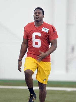 Green Bay Packers rookie Blake Sims (6) runs through footwork drills during rookie orientation in the Don Hutson Center.
