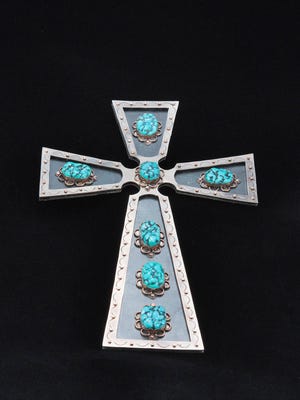 "Southwest Sleeping Beauty Cross" by Lou Mancel is part of the "Enchanted Inspirations" exhibition opening this weekend on the San Juan College campus in Farmington.
