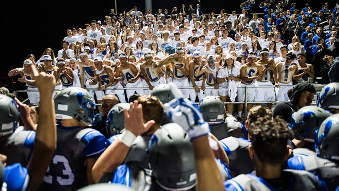 The Cedar Crest football team and student section celebrate after the Falcons won the 46th annual Cedar Bowl, 42-14 on Friday, Sep. 1. The win helped Cedar Crest to its first 3-0 start since 1997.