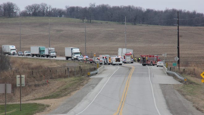 Emergency crews work the scene of a two-vehicle collision Tuesday, Dec. 15, on U.S. Highway 151 north of Amana