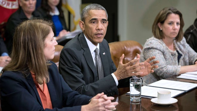 Health and Human Services Secretary Sylvia Mathews Burwell, left, and homeland security adviser Lisa Monaco listen to President Obama make a statement about the Ebola virus after a meeting in the Roosevelt Room on Oct. 6, 2014.