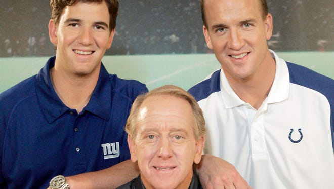 In this May 8, 2008, file photo, Archie Manning, center, is joined by his sons Eli Manning, left, and Peyton Manning, in Beverly Hills, Calif.