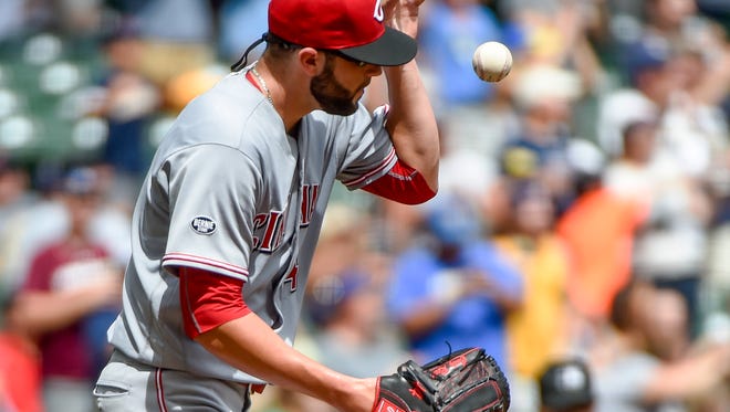 Cincinnati Reds pitcher Cody Reed reacts after giving up a three-run home run to the Milwaukee Brewers' Ryan Braun during the second inning of a baseball game Sunday, Aug. 14, 2016, in Milwaukee.