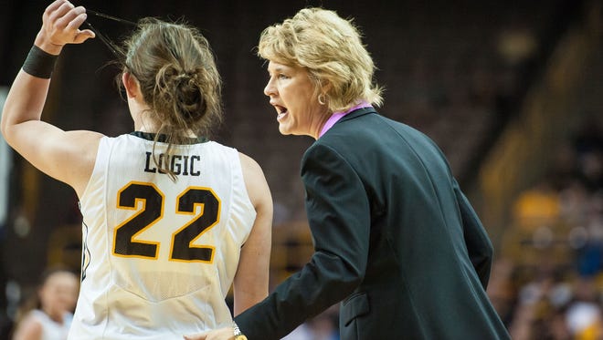 Iowa Hawkeyes head coach Lisa Bluder gives instructions to guard Samantha Logic (22) during the first half against the Miami (FL) Hurricanes in the second round of the women's NCAA Tournament at Carver-City Hawkeye Arena.