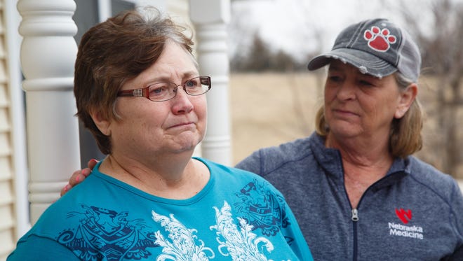 Beth Fry, mother of Amy Sharp, is comforted by Jana Weland, right, as she speaks about her daughter and her family at Fry's home on Friday, March 23, 2018, in Creston. Sharp and her husband Kevin and two children were found dead in their vacation condo in Mexico on Friday morning.