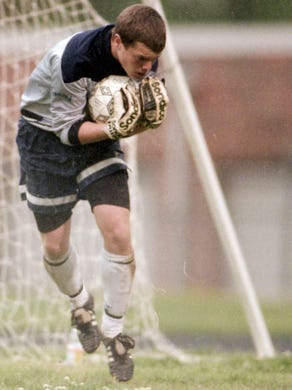 West High School's Andy Adams stops a shot during a game against Farragut in April 1998.