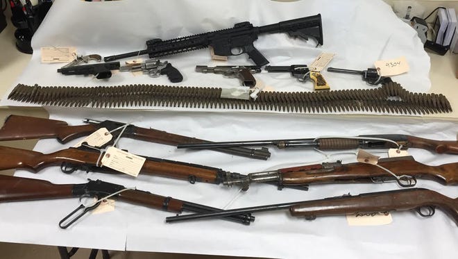 Guns and ammunition recovered during three searches conducted in Oasis Wednesday morning.