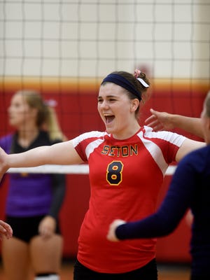 Seton's Maggie Westjohn celebrates a point against Hagerstown Thursday, Sept. 1, 2016 during a volleyball game at Seton Catholic High School in Richmond.