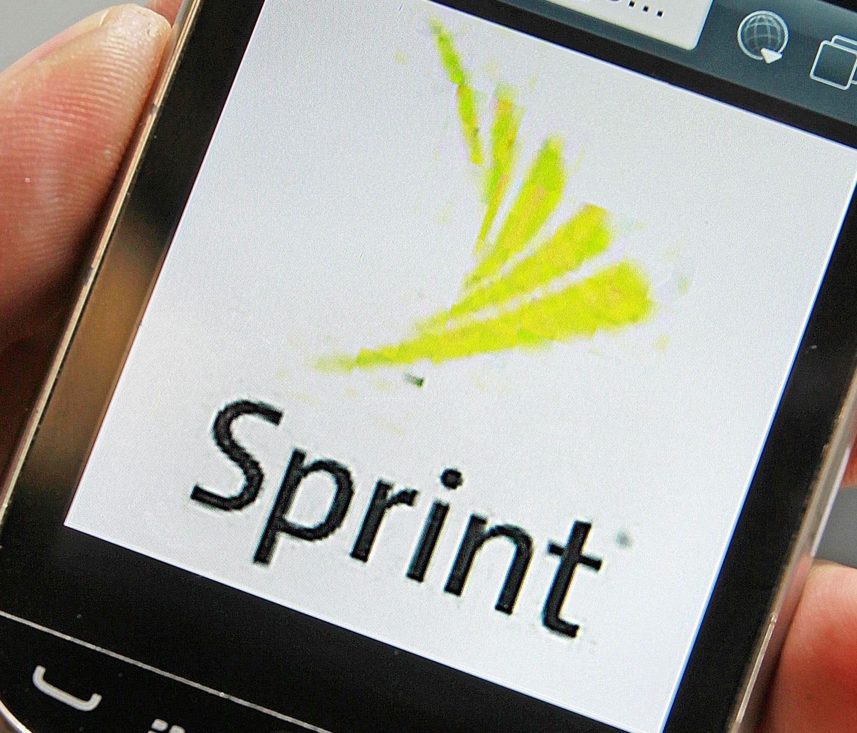 File photo taken in 2013 shows a Sprint logo is displayed on a smart phone in Montpelier, Vt.