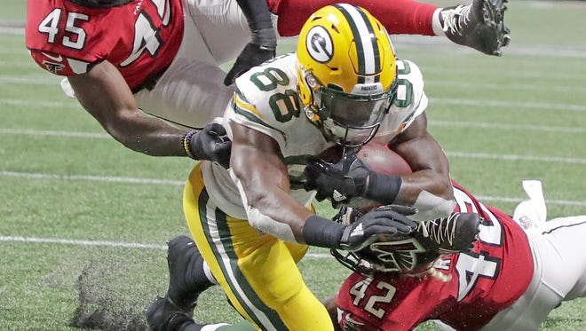 Green Bay Packers running back Ty Montgomery (88) scores a touchdown against the Atlanta Falcons on Sept. 17, 2017, at Mercedes-Benz Stadium in Atlanta.
