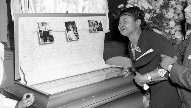 Mamie Till Mobley, mother of Emmett Till, cries at her son's funeral in Chicago in 1955.