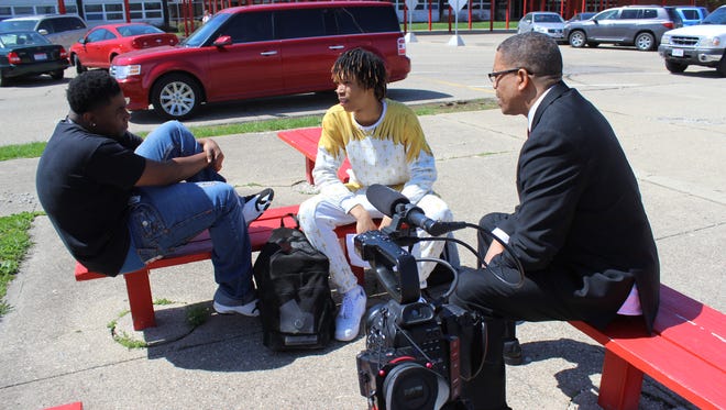 Colerain High School students Will Packnett and Robert Sargent worked with Eric Ellis of Integrity Development, a diversity consulting firm, on a positive rap video for a weekend program.