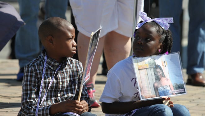Kameron Ray, left, and Calia Dickerson were two of the children at Saturday's Remember My Name Ceremony at Veterans Plaza who lost their mothers to domestic violence.