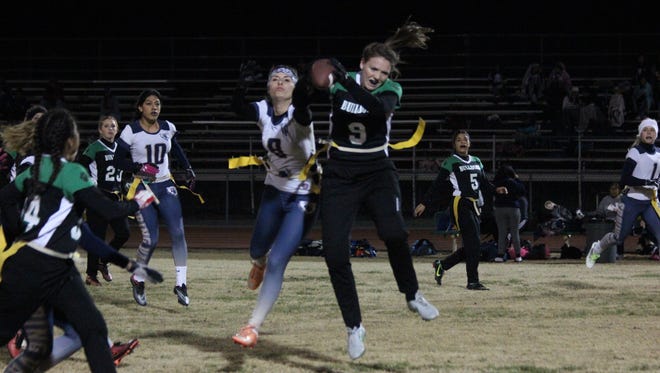 Dylan Bryant of the Lady Bulldogs grabs a pass during Thursday's win over Spring Valley.