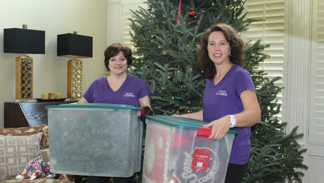 Gretchen Bailey, left, and Amy Jaramillo with Space Claimers say now is the best time to get your Christmas decorations organized for the next year.