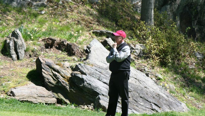 Former Met PGA executive director Charlie Robson strikes his trademark pose as he watches a semifinal match at the Westchester PGA Match Play Championship in 2013.