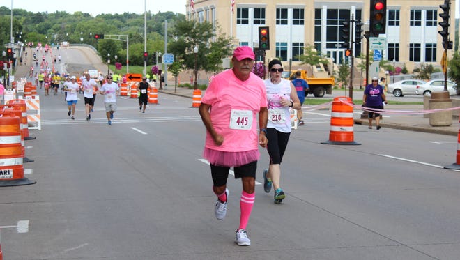 Bill Wasmund of Wausau nears the finish line at the 2016 Komen Central Wisconsin Race for the Cure in downtown Wausau.