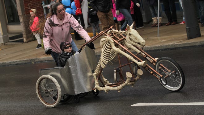 After a brief hiatus because of the pandemic, the Mansfield Halloween Parade will return on Oct. 29. In this 2017 parade photo, Cole Thompson rides down Main Street in a spooky chariot.