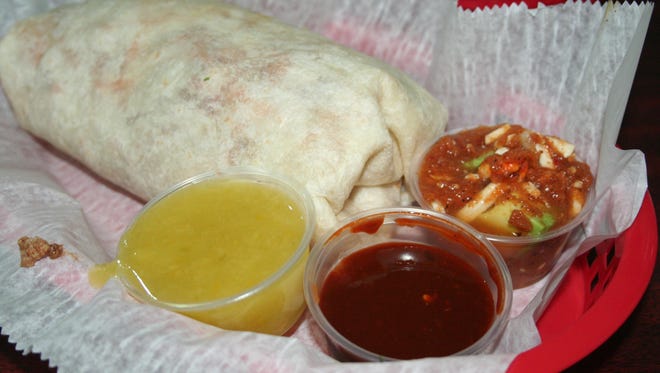 The Torti Burrito Challenge at Torti Taco. With over-the-top heat and enormous size, the challenge is to eat this in three minutes. Also available is your choice of salsas from the Salsa Bar.