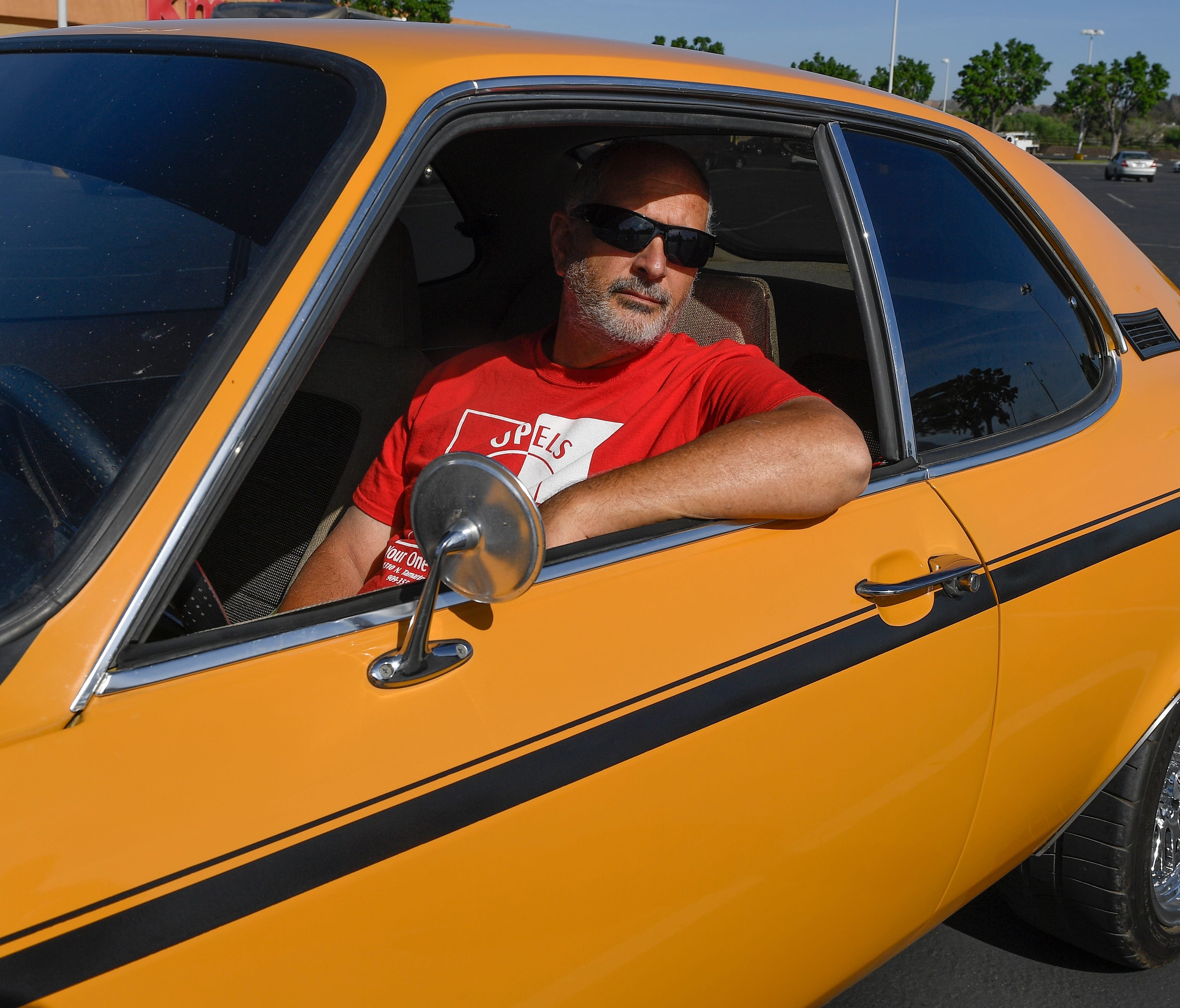 Chris Alviani with his restored 1972 Opel 1900 Manta at the 
