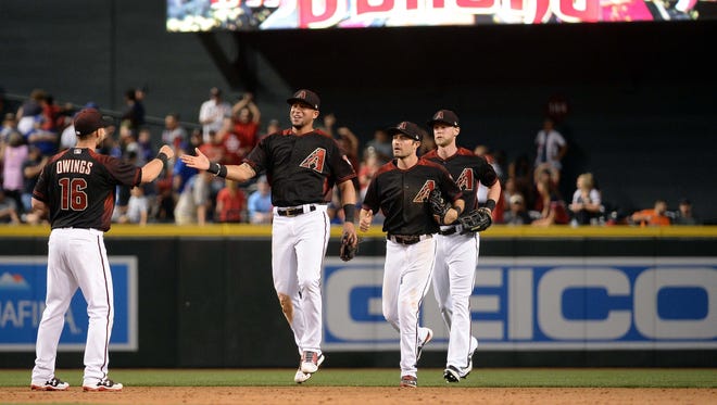 Apr 22, 2017: Arizona Diamondbacks Chris Owings (16), David Peralta (6), A.J. Pollock (11) and Jeremy Hazelbaker (41) celebrate after closing out the game against the Los Angeles Dodgers at Chase Field. The Arizona Diamondbacks won 11-5.