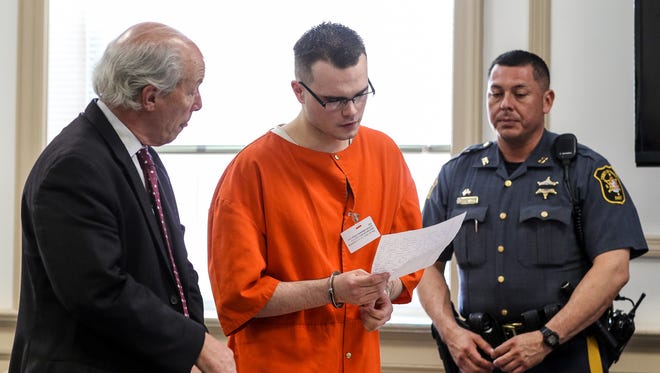 Travis Hofstetter, center, reads a statement next to his attorney, Joel Harris, before Hofstetter's sentencing in State Superior Court, Morristown on June 27, 2016 for the murder of his father, James Hofstetter.
