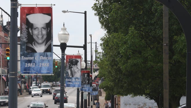 Portraits of local veterans adorn lights posts in downtown Galion.